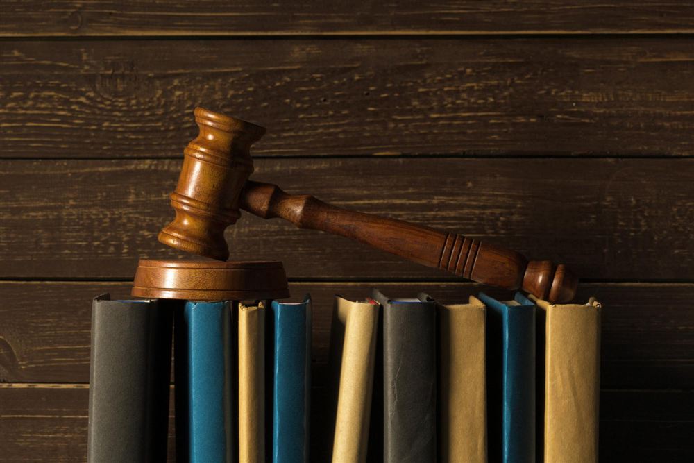 Gavel resting on a row of books