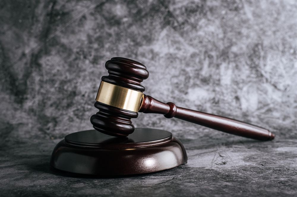 Gavel on a dark stone surface