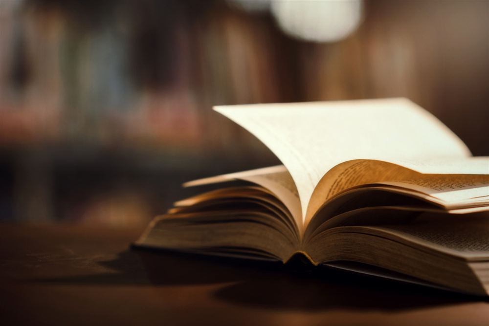 Open book on a wooden table